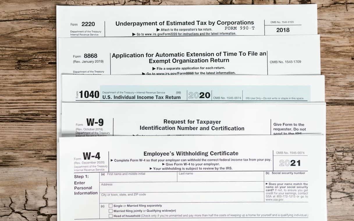 tax forms on wooden surface